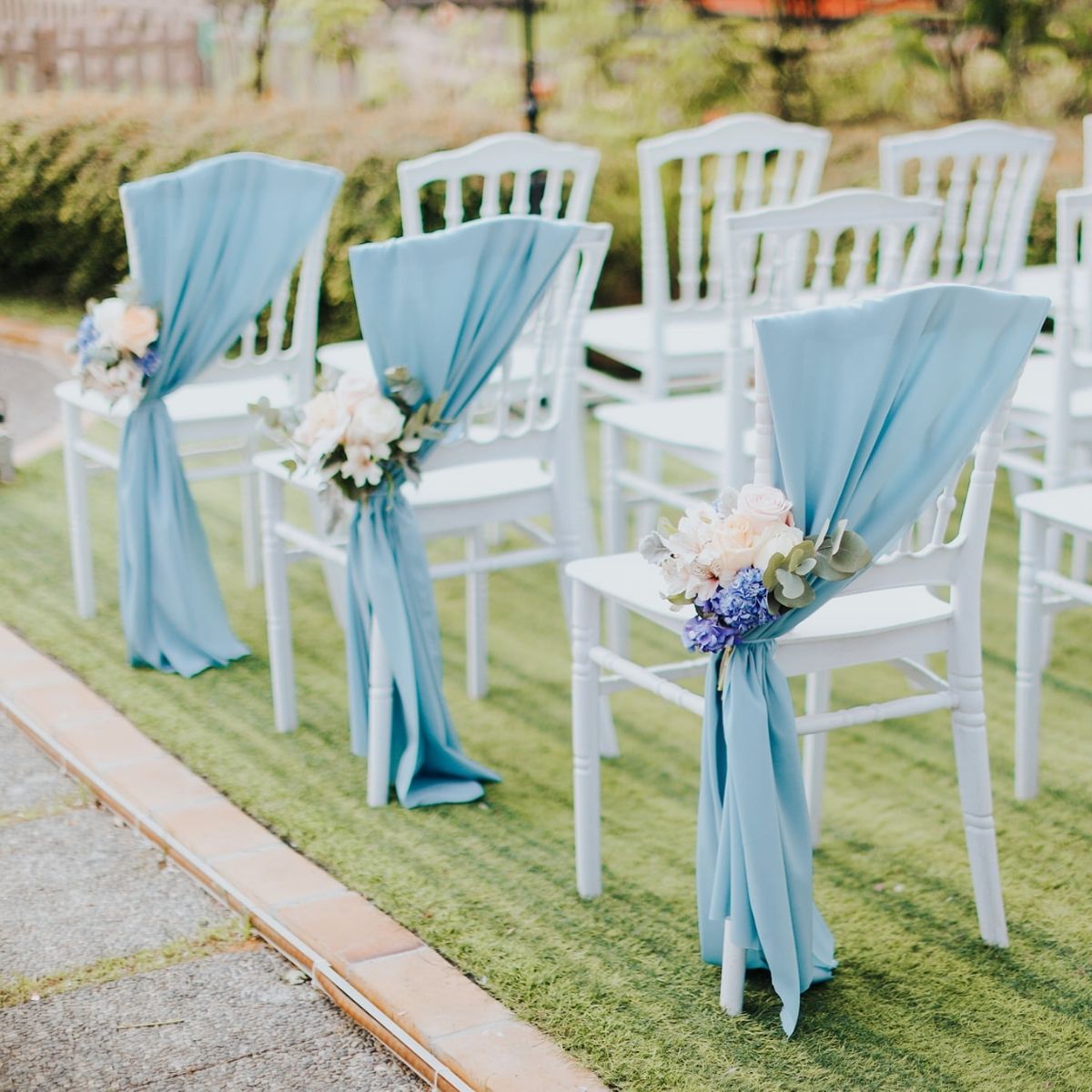 Summerhouse outdoor Seletar pew ties blue ribbon sash white chairs ceremony Singapore