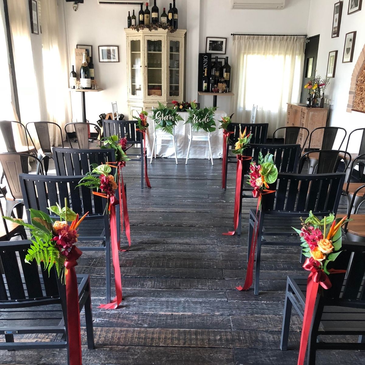 Tropical elegant contemporary pew ties red ribbon dark chairs ceremony Singapore