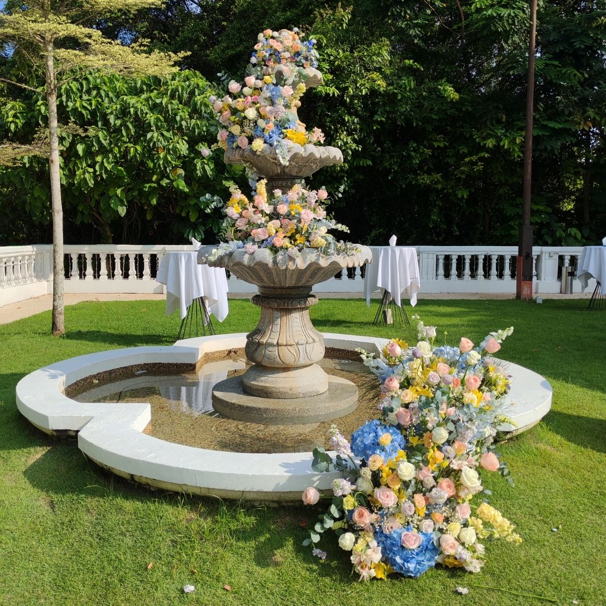Alkaff Mansion fountain venue styling floral arch mixed blooms garden Singapore