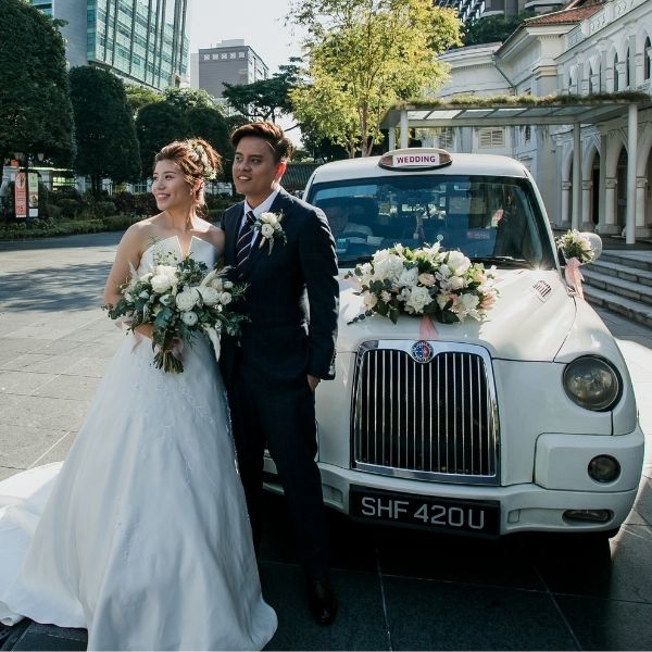 Bride and groom with wedding florals by Fleuriste Singapore