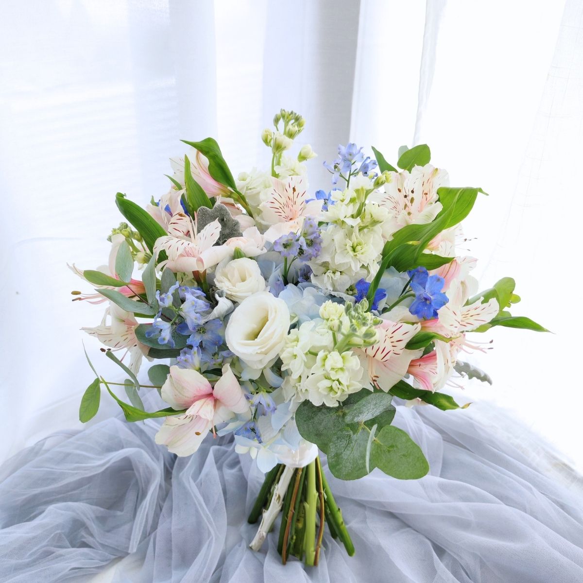 Classic bridal bouquet blue delphiniums hydrangea garden style Singapore