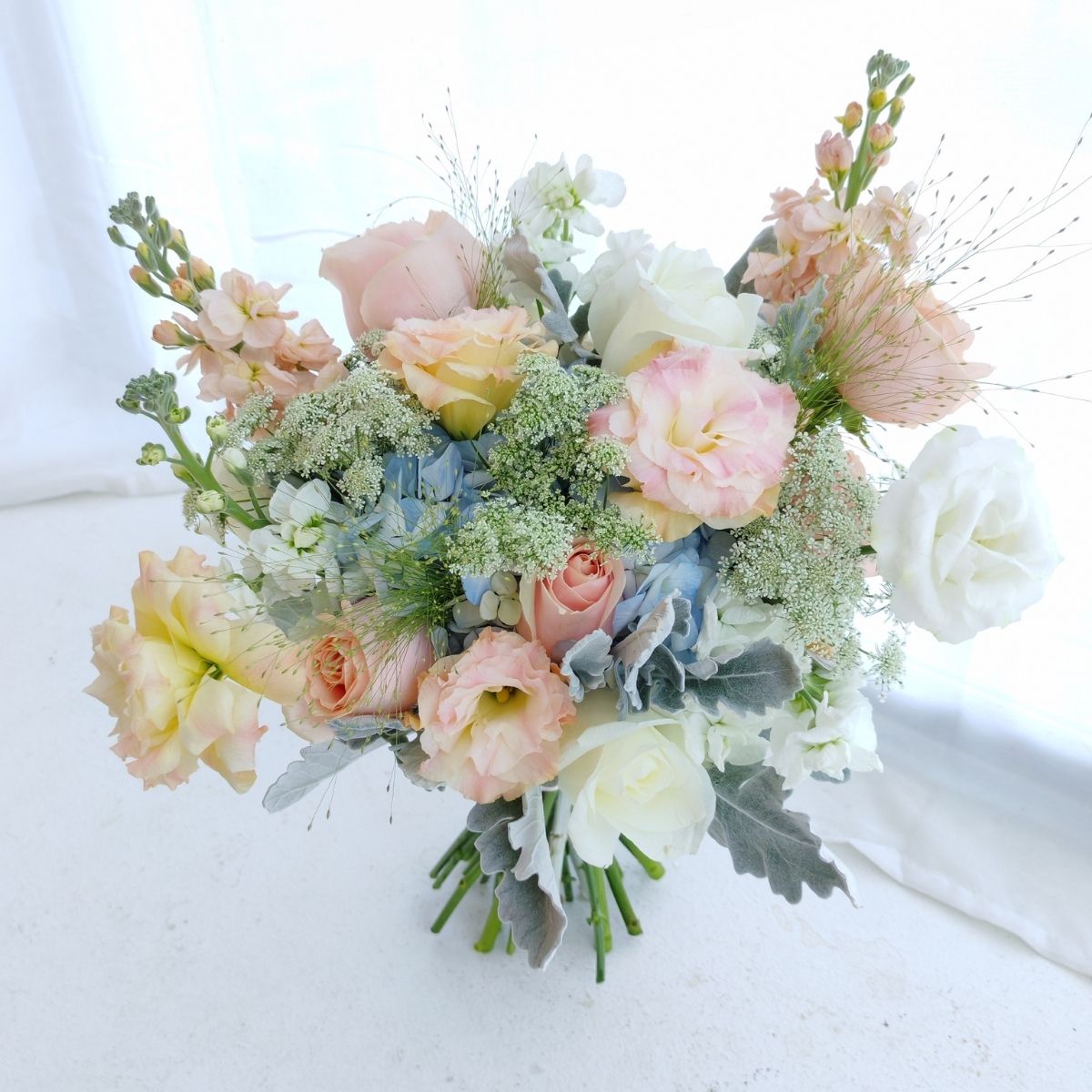 Classic bridal bouquet mixed blooms mathiolas hydrangea blue eustomas Singapore