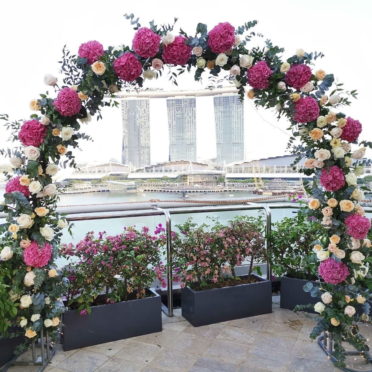 Fresh flowers Fullerton Bay Hotel full floral arch pink white outdoor ceremony Singapore