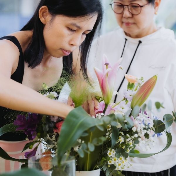 Students working at Fleuriste SkillsFuture WSQ floristry class Singapore